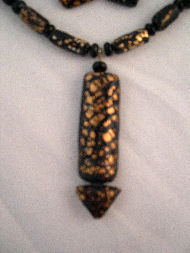 Black and Gold Foiled Pendant Close Up