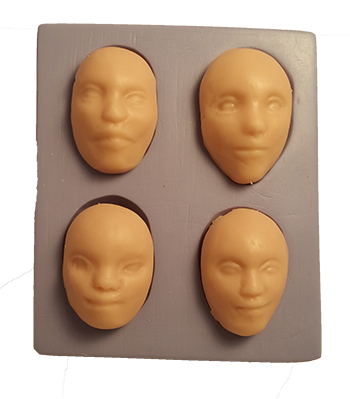four cabochon doll faces push mold
